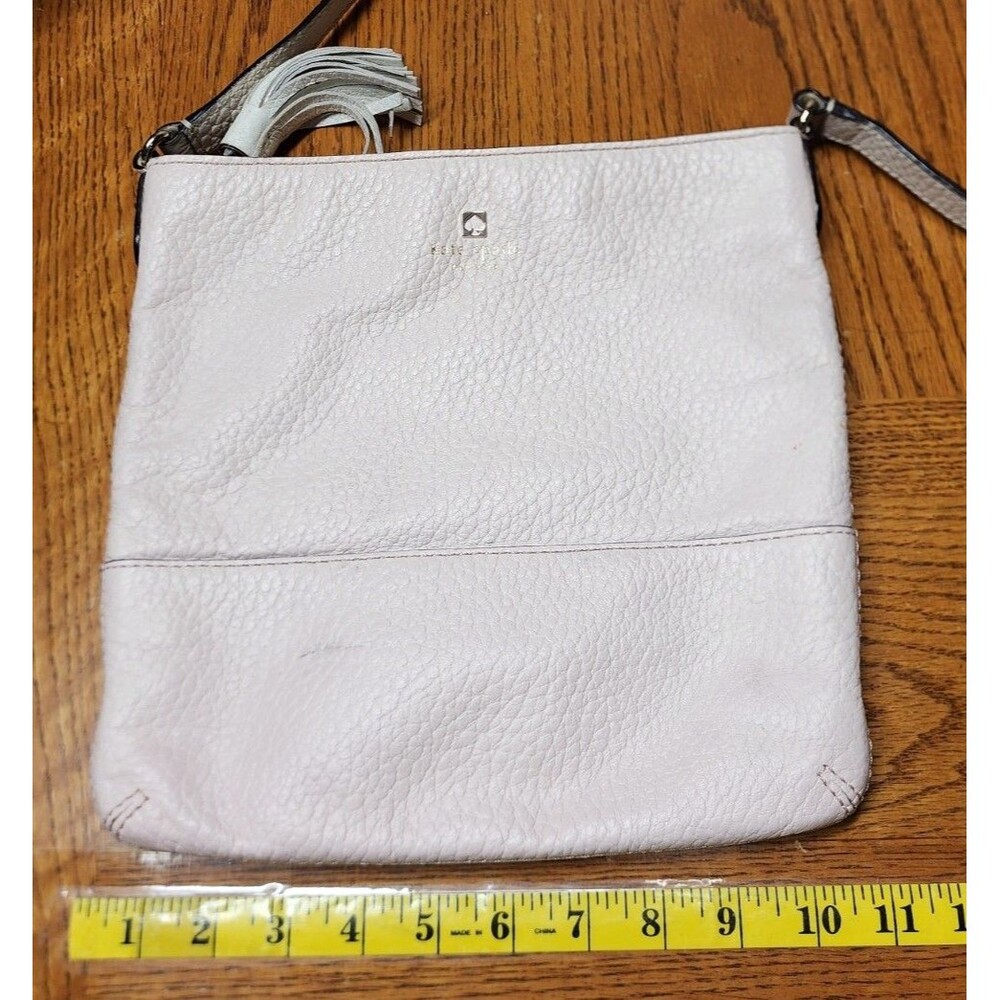 Kate Spade Light Pink Pebbled Leather With White Tassel And Crossbody Strap